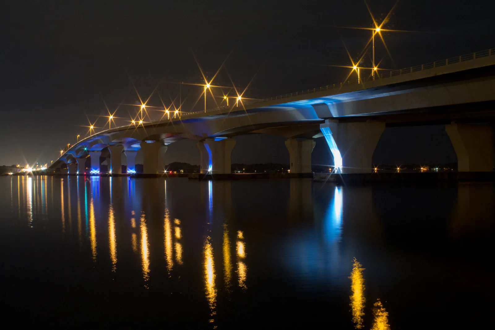 The Hathaway Bridge over St. Andrew Bay at night, looking west from the Panama City side. Carl Gray Park sits by the bridge's eastern end.