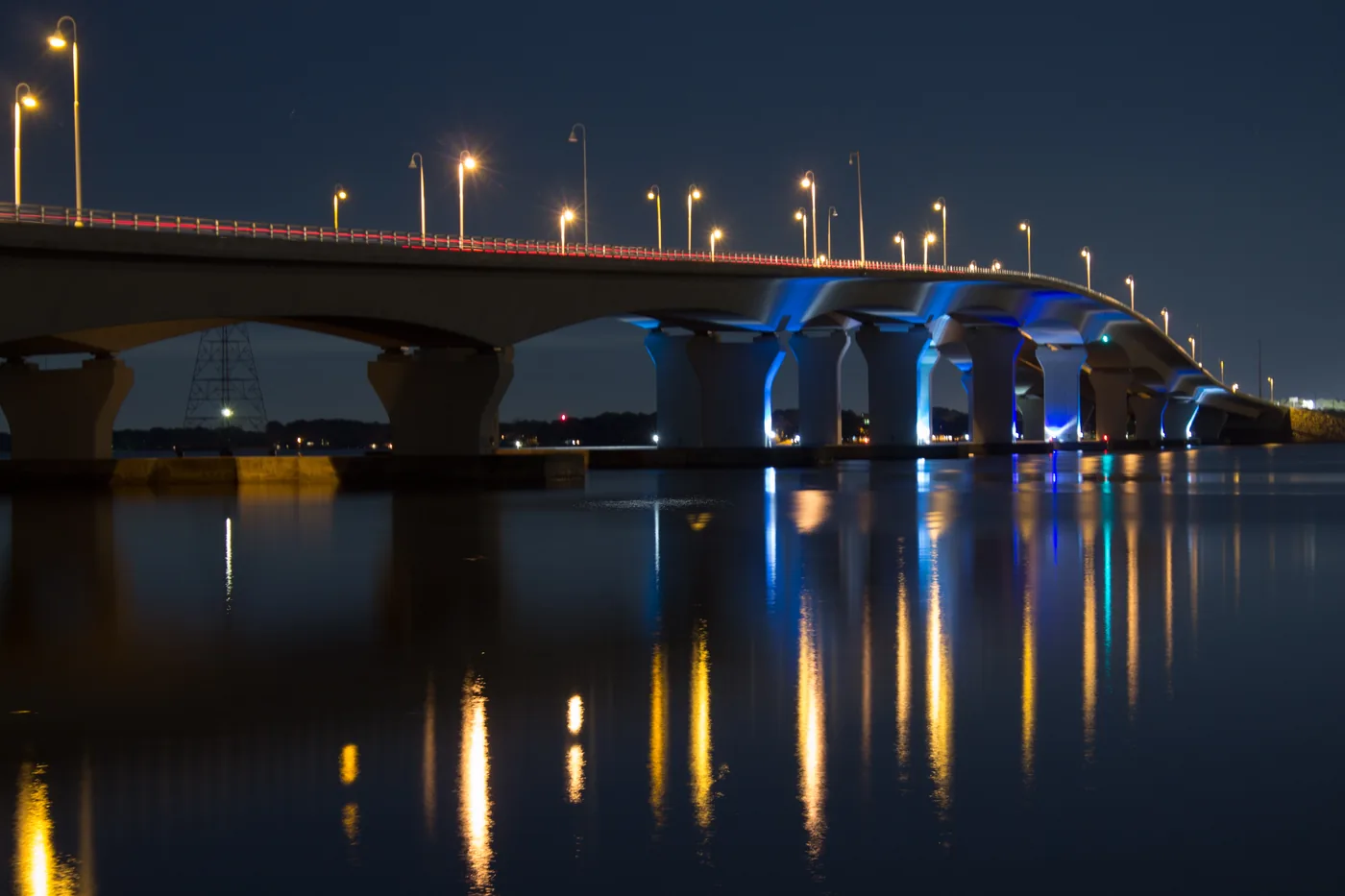 The Hathaway Bridge lit at night over St. Andrew Bay, the western end of the Boat Parade of Lights route.