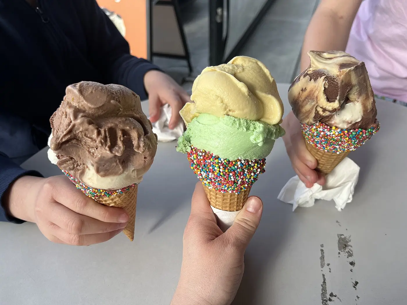 Three ice cream cones held up side by side. The photo was not taken in Panama City.