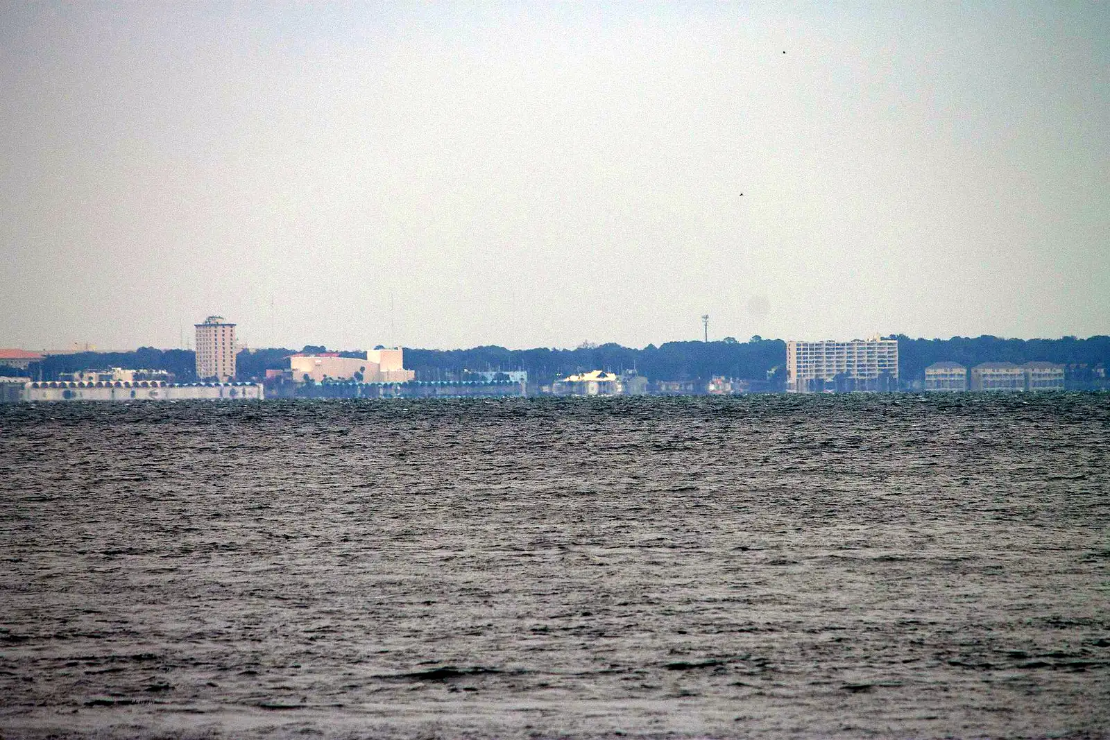 Panama City's waterfront across St. Andrews Bay, seen from St. Andrews State Park.