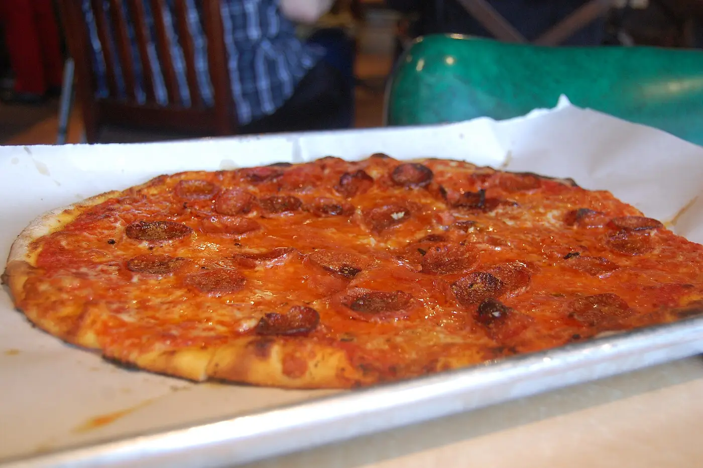 A pepperoni pizza on a tray. The photo was not taken at a Panama City restaurant.